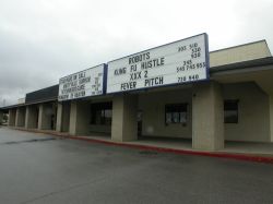 The 5 Star Cinemas has two attraction boards above the theater entrance.