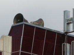 Loudspeakers on top of the theater, near the 'Huish' sign. - , Utah