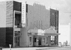 The southern half of the Roxy Theatre site was originally occupied by Rosenbaum Hall.  In 1904 a brick addition was added on the north.  In 1930 a 25-foot addition was added in back and a single roof was installed over the whole structure.  In 1932, the walls separating the Rosenbaum Hall from the additions was removed and the New Grand theater opened. - , Utah