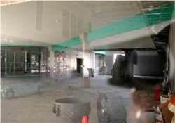 A view of the former lobby with a reflection of the parking lot on the window. - , Utah