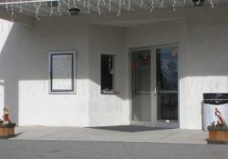 The entrance of Scooter's Theater had a set of double doors with a single ticket window and a poser case. - , Utah