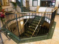 In the center of the lobby is an open area with a stairway leading to the basement. - , Utah