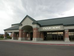 The entrance of the Stadium Cinemas.  The ticket booth is behind the brick pillars on the left of the entrance doors.