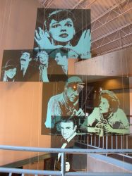 The Trolley Corners theater was decorated with paintings of movie stars.  These painting were hung in an open area between the upper lobby and the levels below. - , Utah