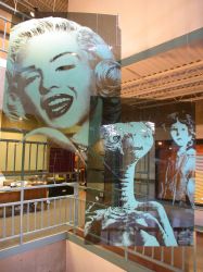 Images of Marilyn Monroe and E.T. hang on the right of the ticket booth, over an area open to four levels of the complex. - , Utah