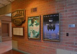 On the right of the south hall are two poster cases and a directory for the Trolley Corners building. - , Utah