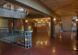 The main level of the Trolley Corners complex.  On the left is the entrance to office and the projection booths for theaters 2 &3.  The ticket booth is in the center.  On the right is the main stairway.  Two elevators are out of the photo on the right. - , Utah
