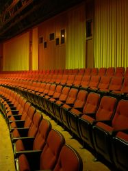 The last few rows of seats in Trolley Corners Theater 1, with the projection booth windows along the back wall.  When the theater closed it still had two Century 70mm projectors in its booth. - , Utah