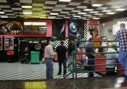 From the food court of the Valley Fair Mall there are a few steps down into the lobby of the Cinemark Movies 9. - , Utah