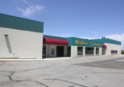 The lobby of the Walker Cinemas is located in the center of the building, with theater auditoriums on either side. - , Utah