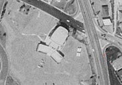 An aerial photo of the Whilshire Theatre from 1997.  The original auditorium is in the northeast corner of the building.  The lobby, in the center, connected to two smaller auditoriums which were added in the mid-1970s.  The Whilshire closed 4 October 1998 and was later demolished. - , Utah